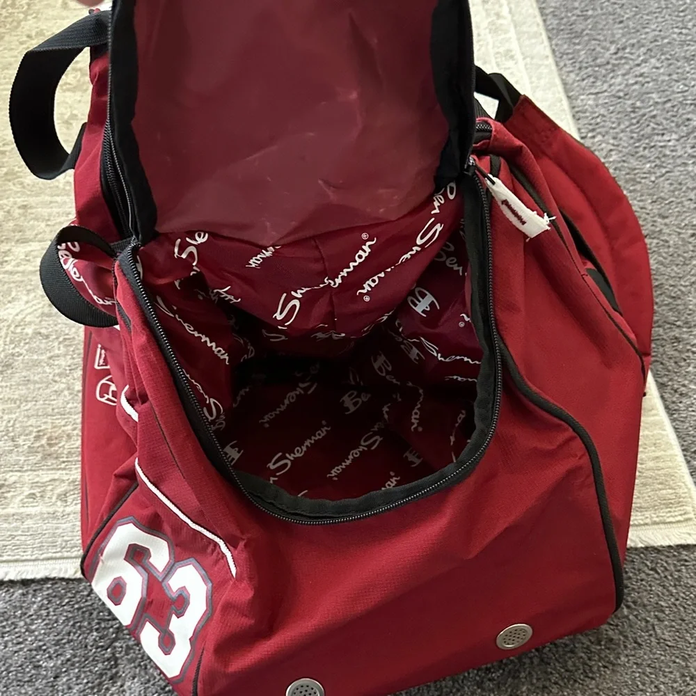 Ben Sherman Burgundy Duffel Bag with Black Accents.